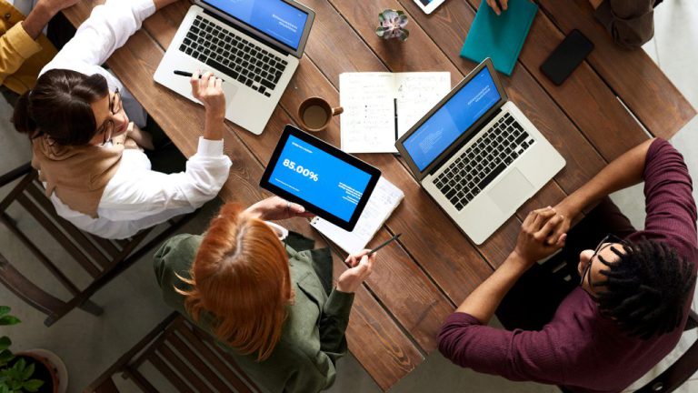 People with laptops working on the meeting
